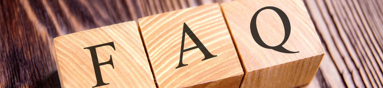 Cubes with an inscription FAQ on the old boards. Close-up.